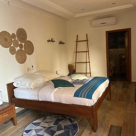 L'Oasis Guesthouse Cotonou Exterior foto